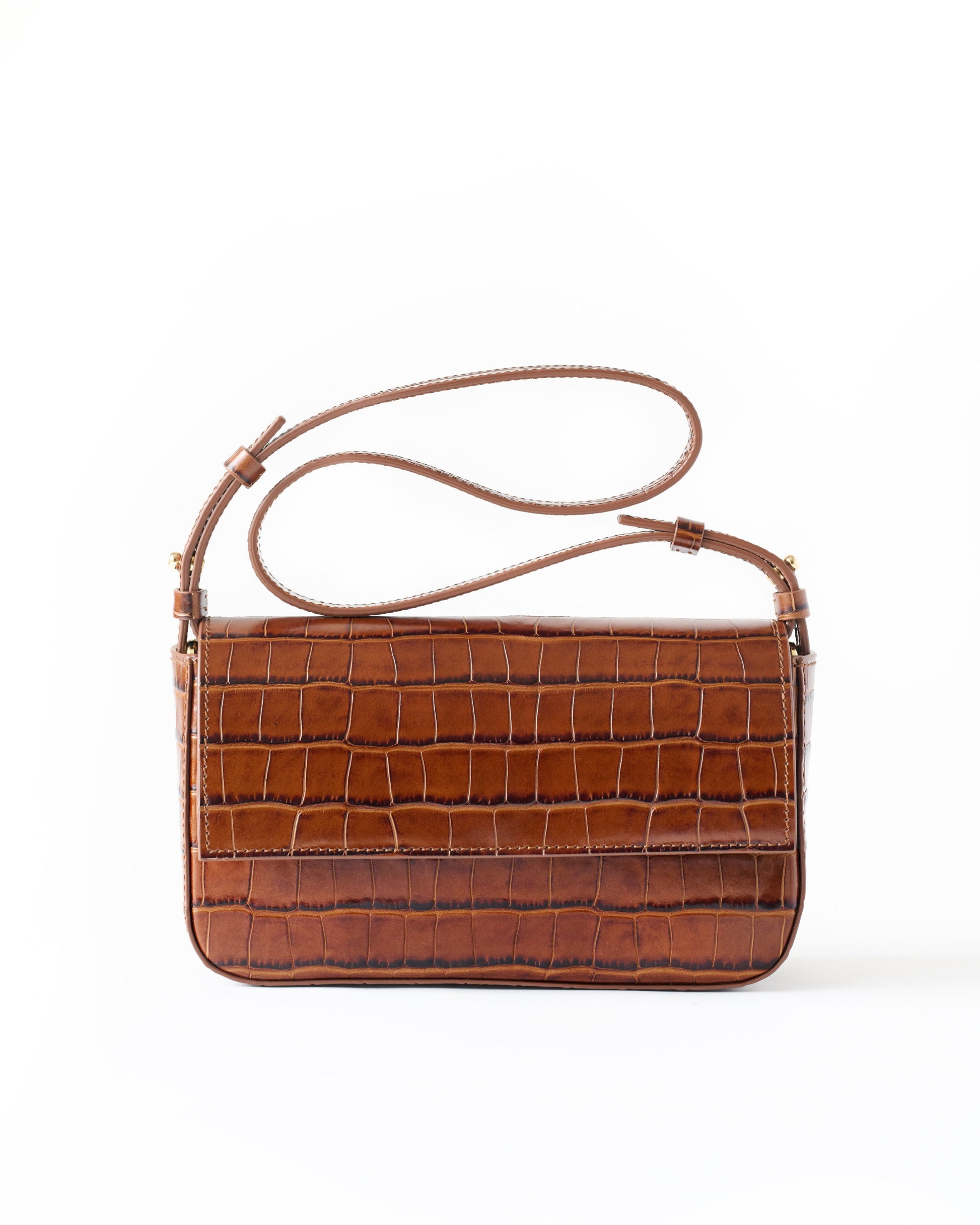 Brown crocodile-patterned handbag on a white background